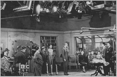 The Mitchell Standard camera as a big box behind Hitchcock on the set of Rope